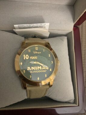 Disney Gold-Tone Animal Kingdom 10 Years Watch with Green Dial